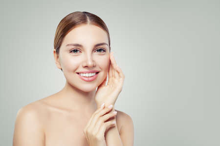 Young woman face. Perfect girl with healthy skin. Healthcare and spa concept.の写真素材