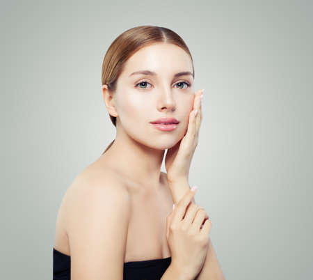 Natural beauty portrait. Young model woman face. Smiling girl with healthy skinの写真素材