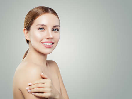 Young woman face. Smiling girl with healthy skin portraitの写真素材