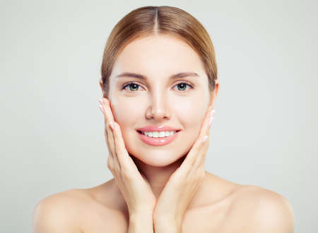 Attractive woman on white. Beautiful female model faceの写真素材