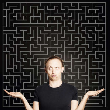 Man thinking and holding two empty open hands. Choice, problem and solution concept