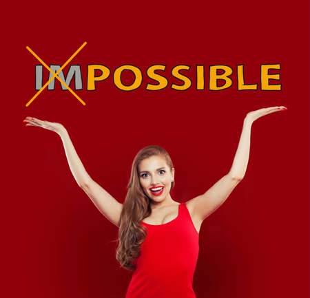 Success, opportunities and achievements concept. Beautiful young excited woman with possible text on colorful bright red background. Positive emotion. Expressive facial expressionの写真素材