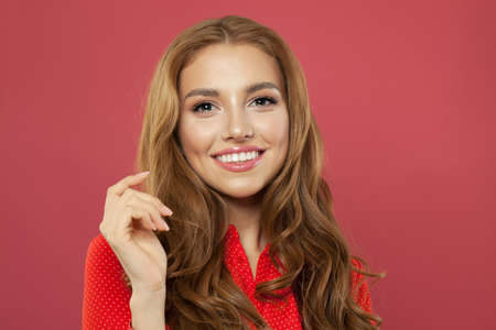 Pretty young beautiful woman laughing. Cute cheerful girl with red curly hair and natural makeup...