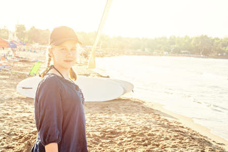 Happy teen girl on sea beach, Greece