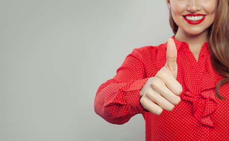 Thumb up. Female hand showing thumb up