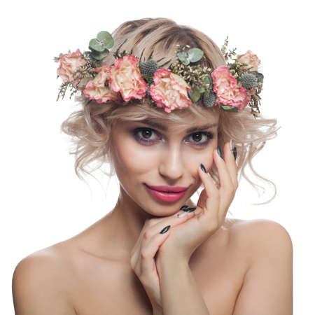 Beauty Fashion Portrait of Cute Model Woman with Short Haircut, Makeup and Flowers Crown Isolatedの写真素材