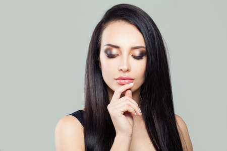 Nice brunette woman face, closeup portraitの写真素材