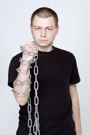 Man and shackles in hand.  The concept of freedom and determinationの写真素材