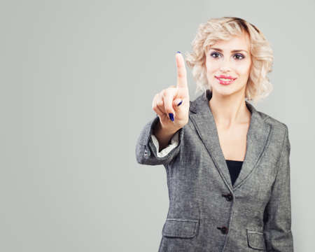 Push button. Pointing businesswoman handの写真素材