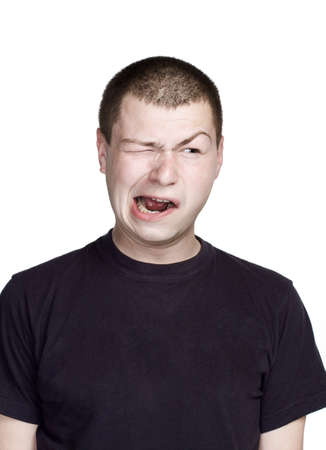 Portrait of young man. Facial expression. Grimace face.の写真素材