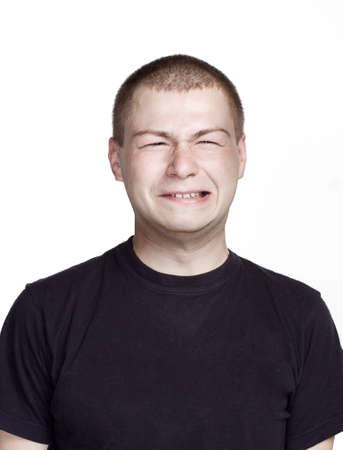 Funny face. Portrait of young man with Facial expression.の写真素材