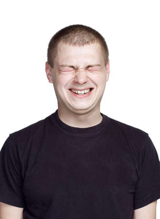Portrait of young man. Facial expression. laugh face.の写真素材