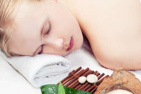 Beautiful young woman getting spa massage. Spa relax massage and aromathrapyの写真素材