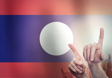 Hands on the background of the Laos flag. Freedom conceptの写真素材