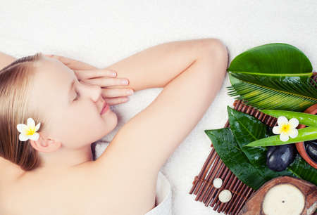 Beautiful young woman getting spa massage with aromatherpy. Spa conceptの写真素材