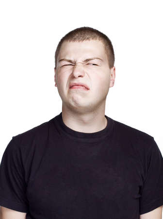 Portrait of young man. Facial expression. Disgust face.の写真素材