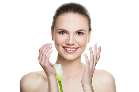 Beautiful smiling model with clear skin isolated. Skincare and facial treatment conceptの写真素材