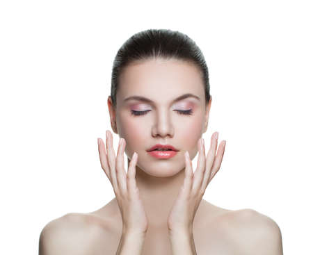 Portrait of cute young woman with clear skin isolated. Skincare and facial treatment conceptの写真素材