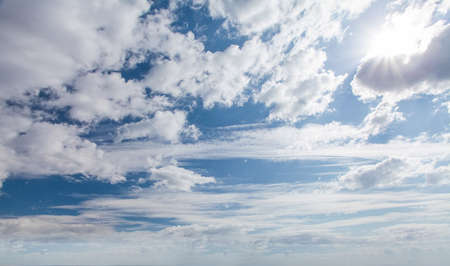 Blue sky clouds background. Beautiful landscape with clouds and sunの写真素材