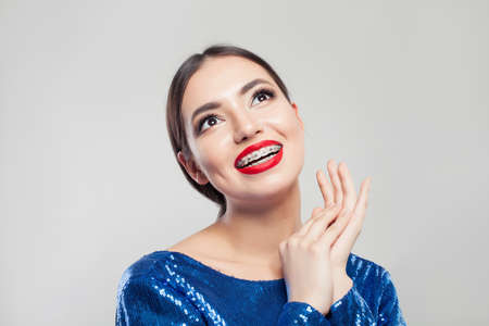 Portrait of pretty girl with braces on teeth.