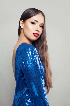 Beautiful woman with red lips make up and long hair.の写真素材
