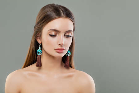 Beautiful woman with jewelry earringsの写真素材