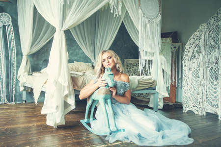 Romantic woman in vintage interior portraitの写真素材