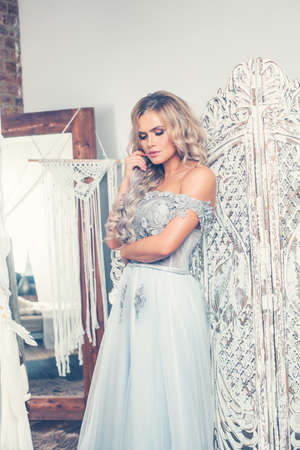 Beauty portrait of pretty young woman in vintage interiorの写真素材