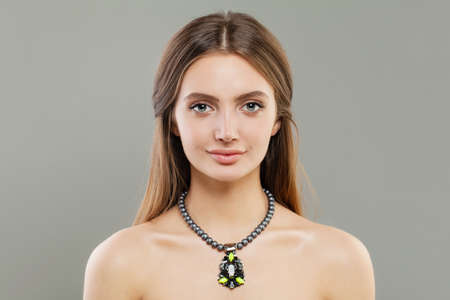 Beautiful model woman in pearls necklaceの写真素材