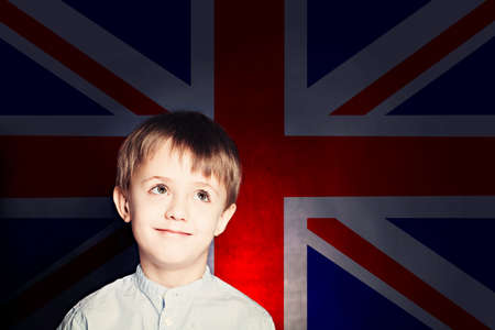 Smiling child boy against the UK flagの写真素材