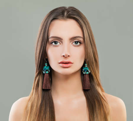 Pretty woman in jewelry earrings portraitの写真素材