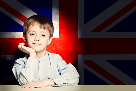 Thinking child boy student against the UK flagの写真素材