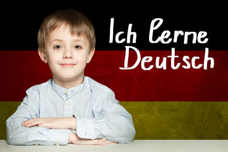 Thinking child boy student against the Germany flag background. Deutsch conceptの写真素材