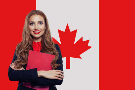 Canada concept. Young woman student with the Canada flag. Live, work, education and internship in Canadaの写真素材