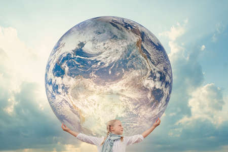 Girl holding the Planet Earth. Future Concept.