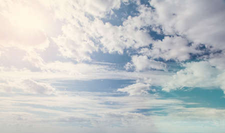 Blue sky clouds background. Beautiful landscape with clouds and sunの写真素材