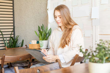 Young pretty woman with laptop gadget indoorの写真素材