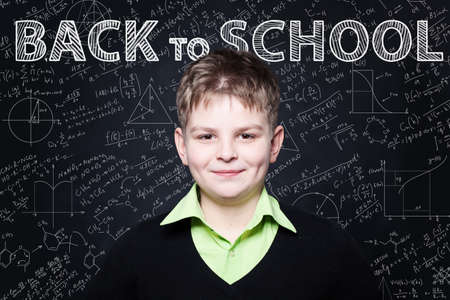 Ðoung Student smiling on chalkboard. Back to school backgroundの写真素材