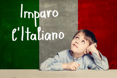 Thinking child boy student against the Italy flagの写真素材