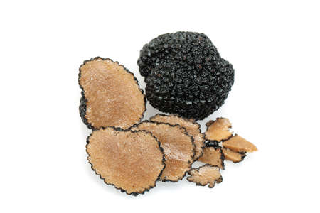 Truffle mushroom. Black gourmet truffle mushroom and slices isolated on whiteの写真素材