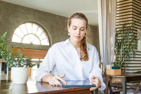 Businesswoman with laptop gadget at workの写真素材