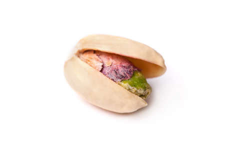 Tasty pistachio nut isolated on whiteの写真素材