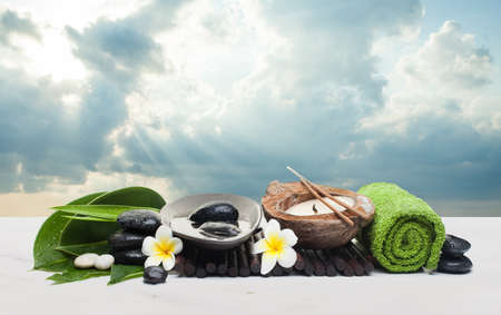 Big spa set with tropical objects for healthy therapy. Spa healthy concept with clouds sky and sunlight.の写真素材