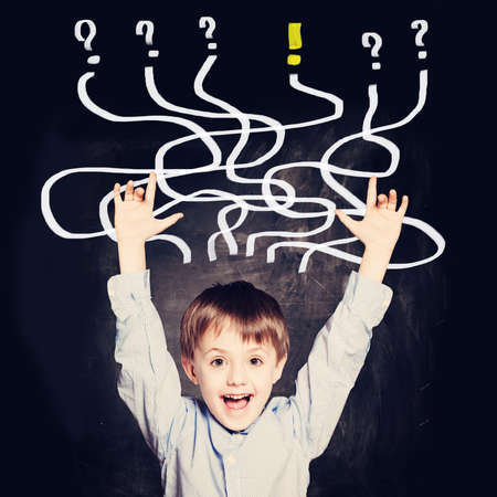School Boy has an idea. Concept with question signs