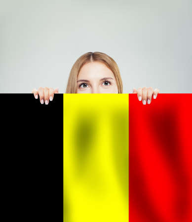 Love Belgium concept. Happy girl show belgian flagの写真素材