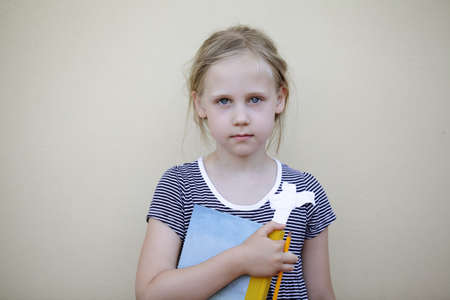 Ð¡ute child with notebook and pencil. Five years old kid, space for advertising textの写真素材