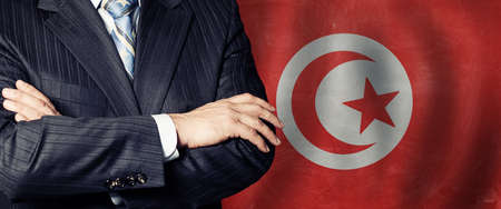 Politician crossed arms of on Tunisia flag background
の写真素材