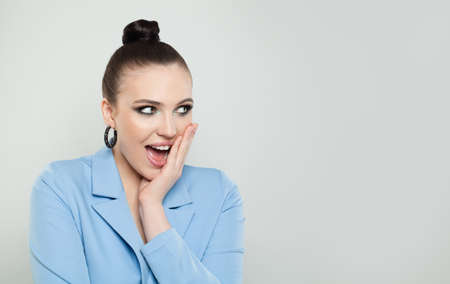 Young happy surprised woman brunette smiling