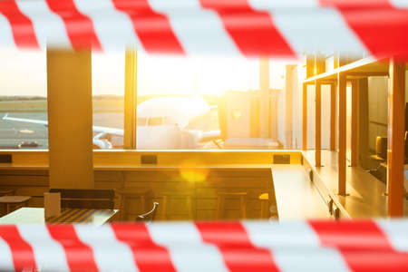 Airplane through airport window closed warning tape