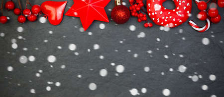 Christmas black and red border with white snowの写真素材